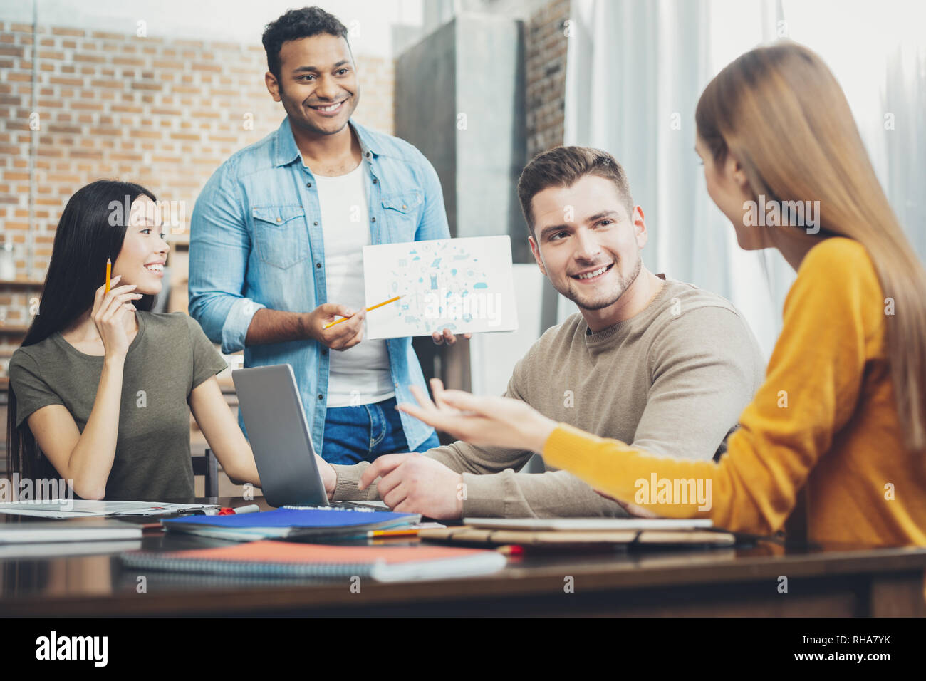 Attractive four students working on project Stock Photo