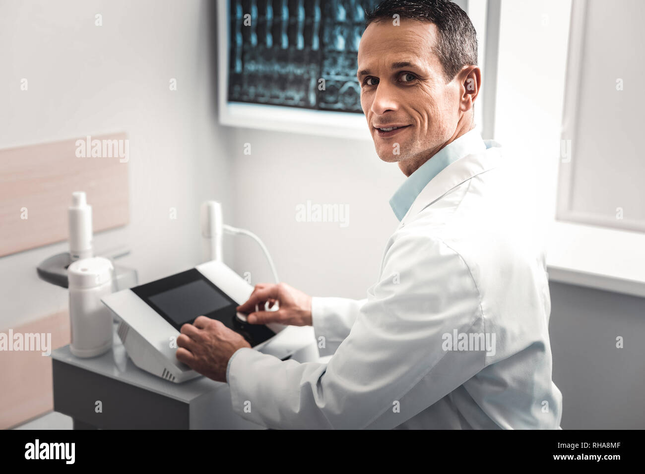 Professional modern chiropractor using medical facilities Stock Photo