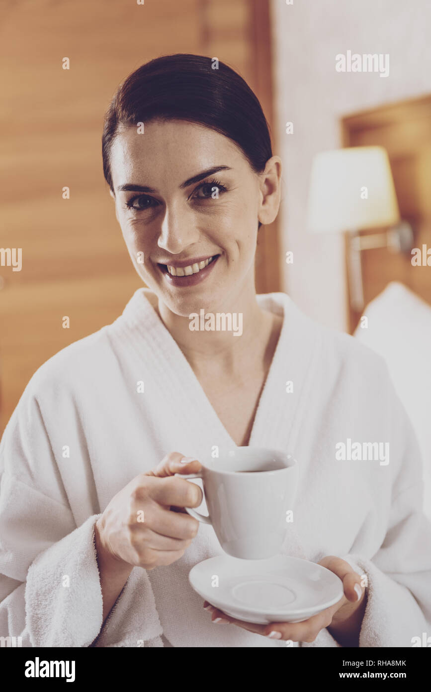 Portrait of positive housewife with cup of tea Stock Photo