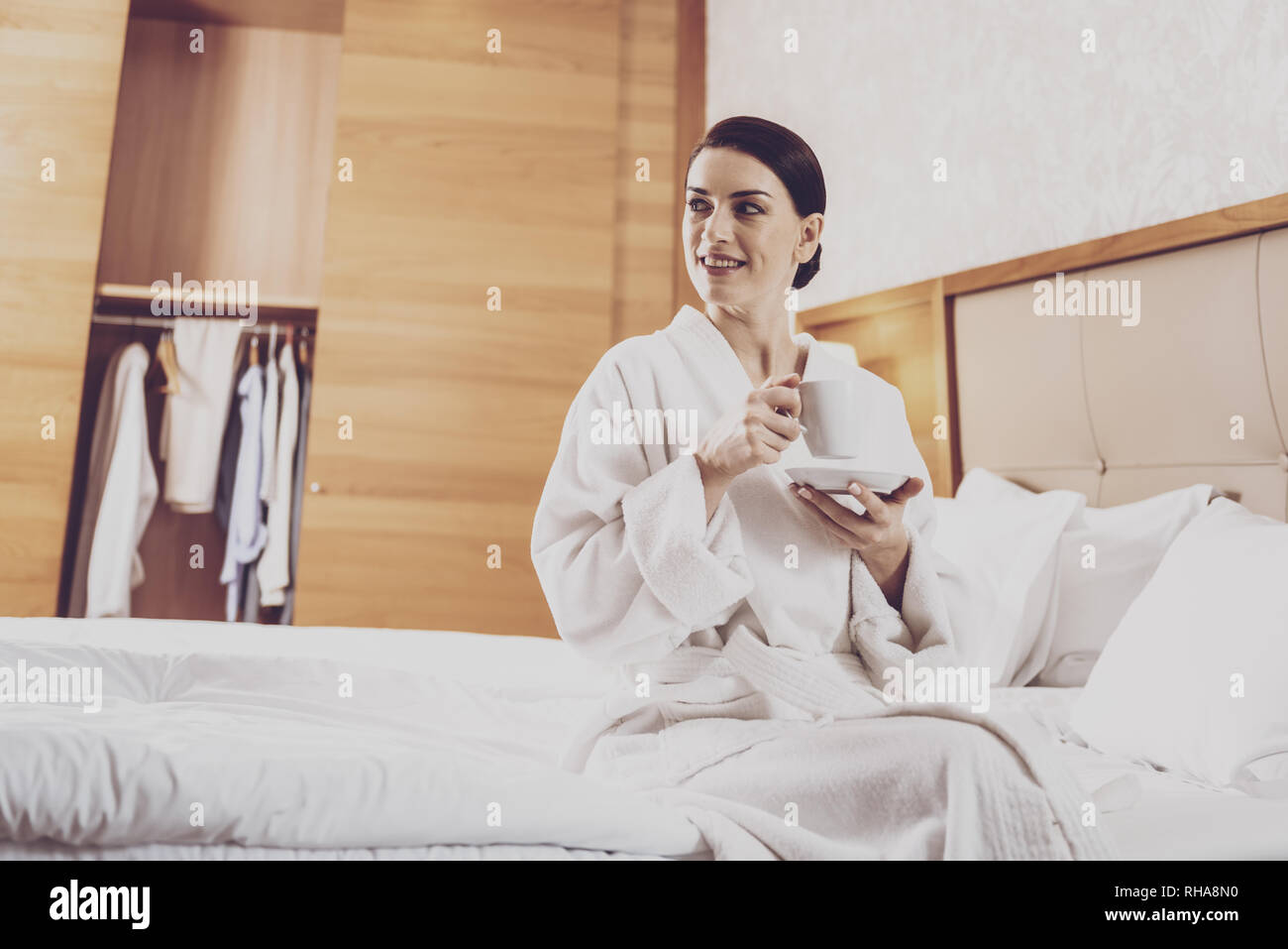 Joyful woman relaxing with cup of tea Stock Photo - Alamy