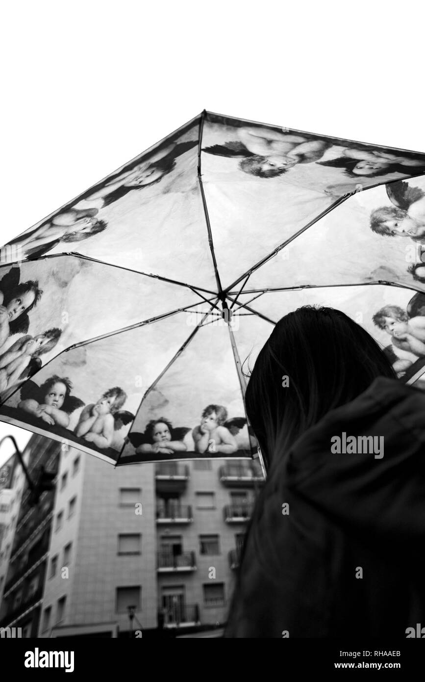 Girl with kitsch decorated umbrella Stock Photo