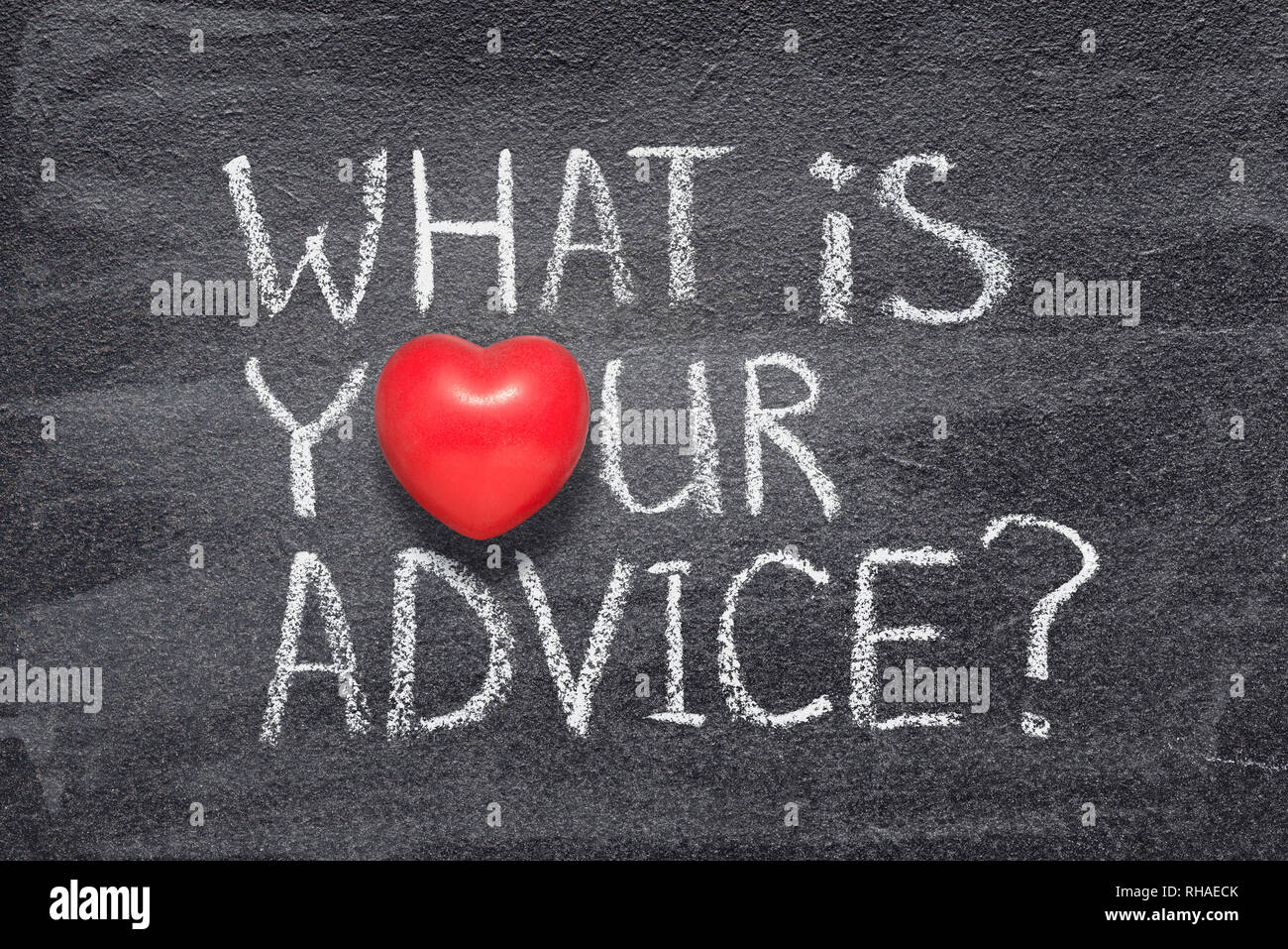what is your advice phrase handwritten on chalkboard with red heart symbol instead of O Stock Photo