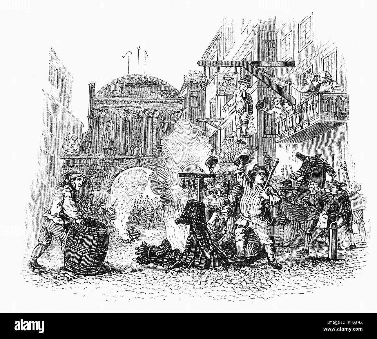 A riotous scene in the street beside Temple Bar, the western boundary of the City of London, with the mob hanging and burning representations of members of the Rump Parliament from a 1726 etching and engraving by William Hogarth Stock Photo
