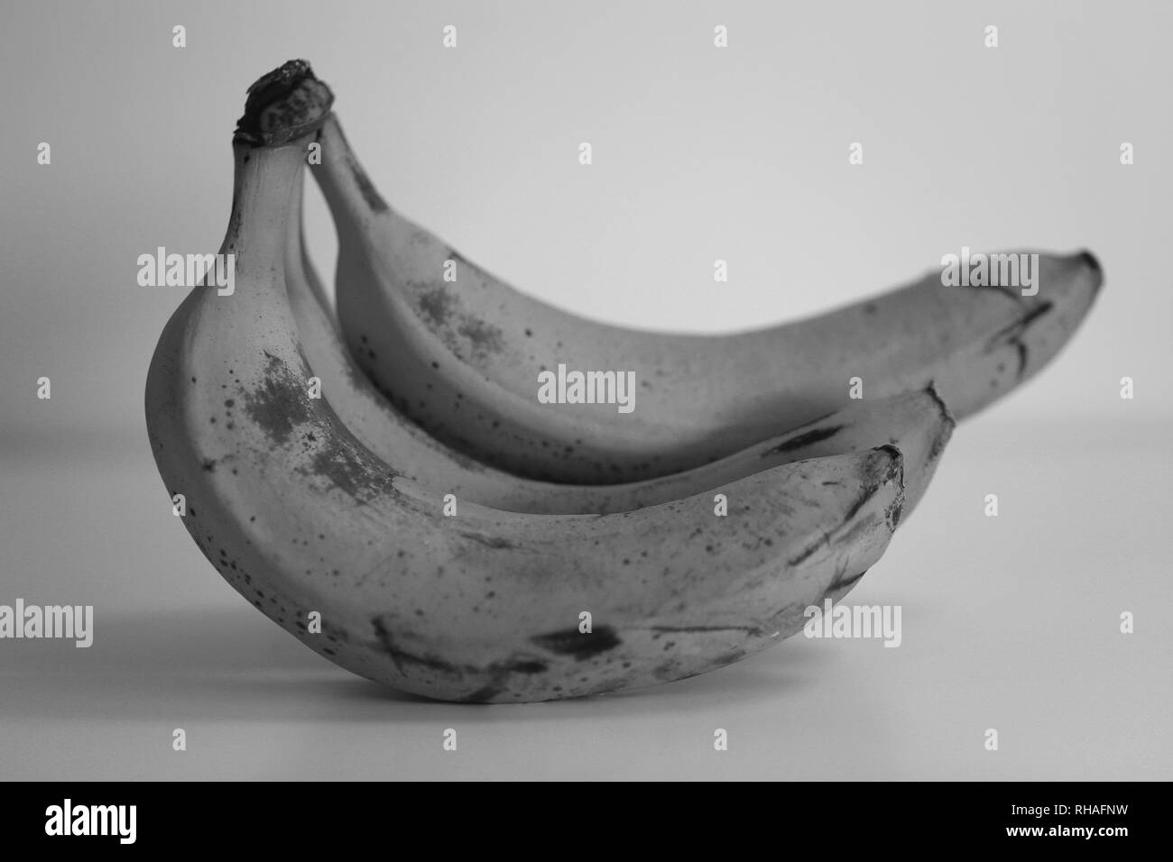 Closeup photo of bananas. Taken with macro objective to show all the smallest details. The bananas are very ripe. Beautiful black & white image. Stock Photo