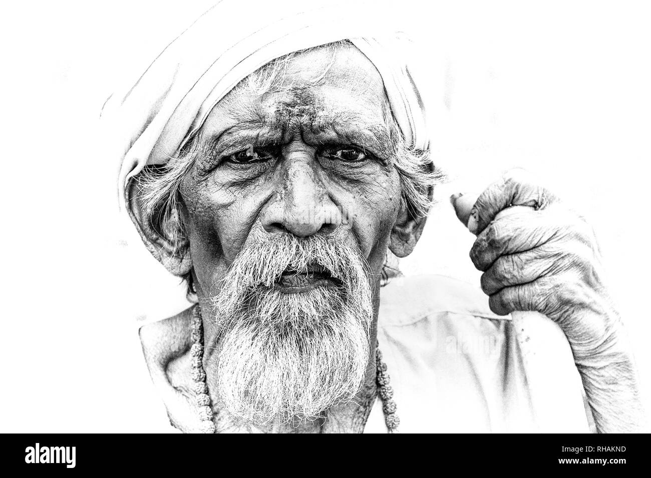 PUDUCHERRY, INDIA - DECEMBER Circa, 2018. Unidentified portrait close-up of old face indian man looking at the camera,very serious. Black and white im Stock Photo