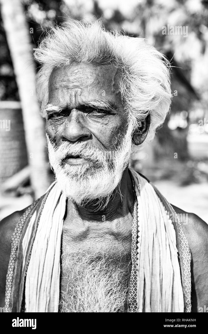 PUDUCHERRY, INDIA - DECEMBER Circa, 2018. Unidentified portrait close-up of old face indian man looking at the camera,very serious. Black and white im Stock Photo