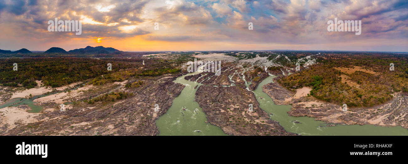 Aerial panoramic 4000 islands Mekong River in Laos, sunset dramatic sky, Li Phi waterfalls, famous travel destination backpacker in South East Asia Stock Photo