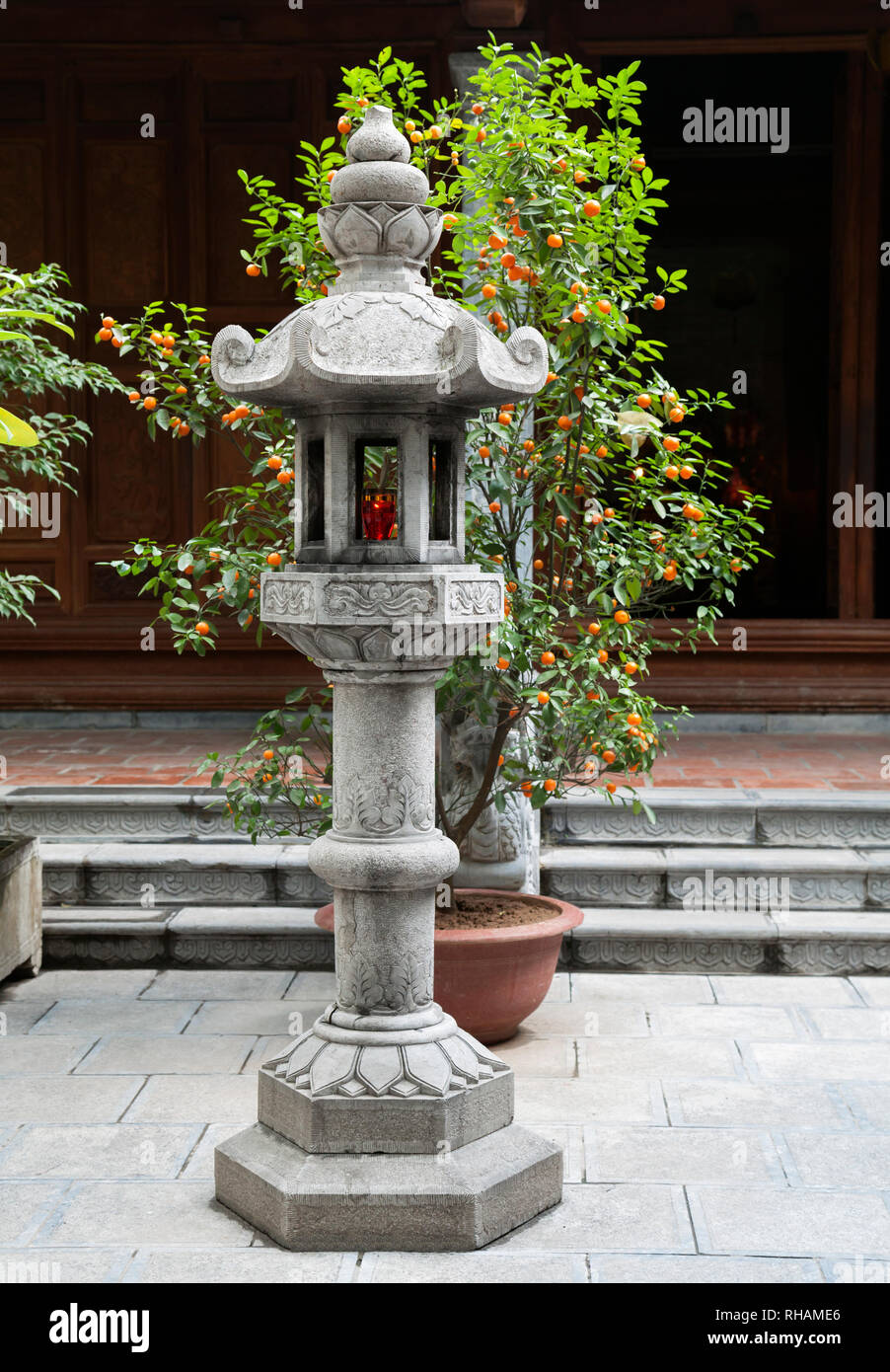 Stone buddhist lamp in japanese garden Stock Photo