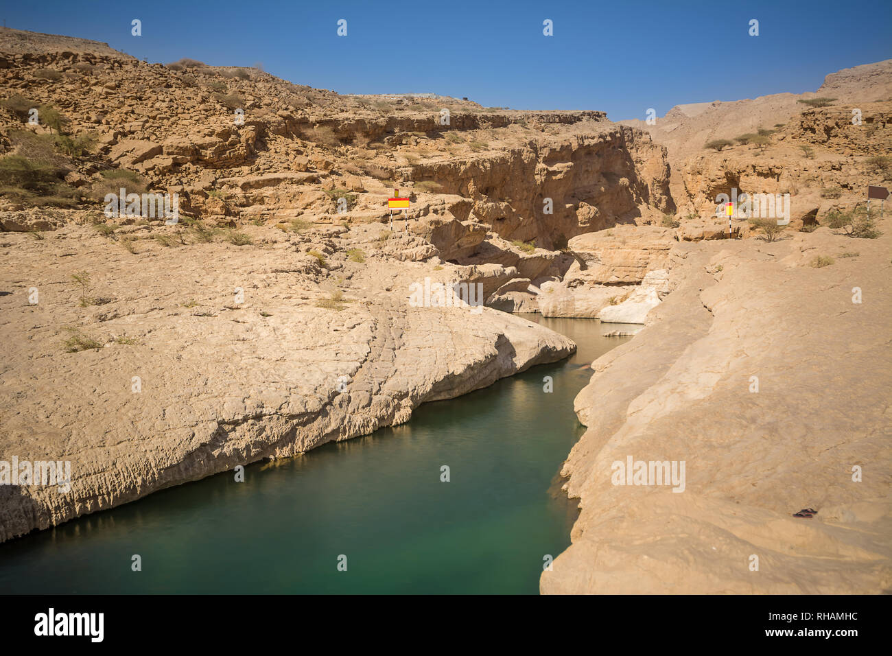 Splitting in the rock with water at Wadi Bani Khalid (Oman) Stock Photo