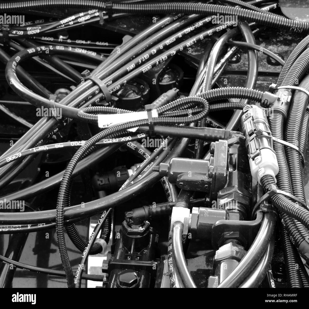 Engine wiring with bundles of isolation tubes, coolant hoses and corrugated pipes Stock Photo