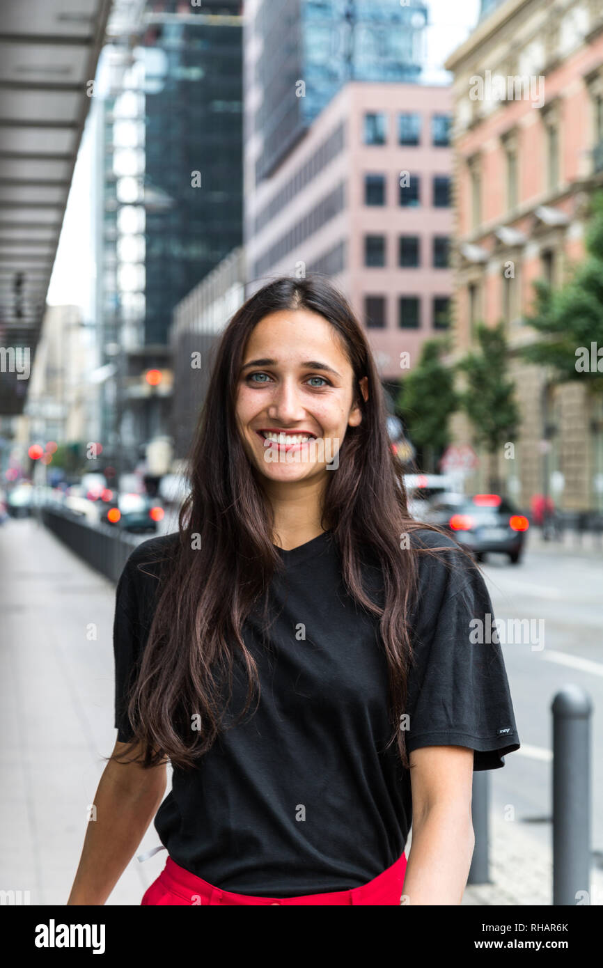 Woman walking on the sidewalk hi-res stock photography and images - Alamy