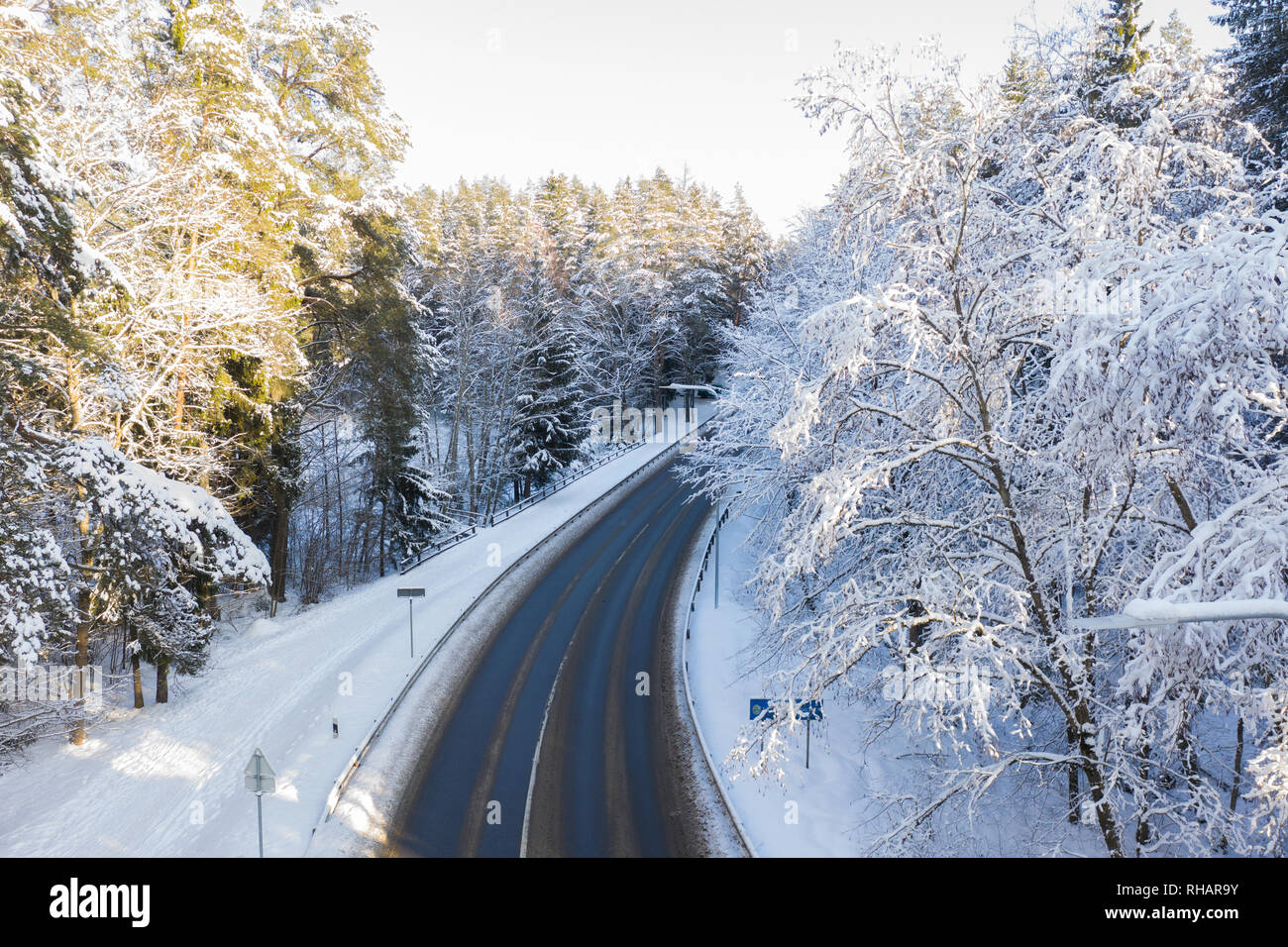 Narrow snowy forest road hi-res stock photography and images - Alamy