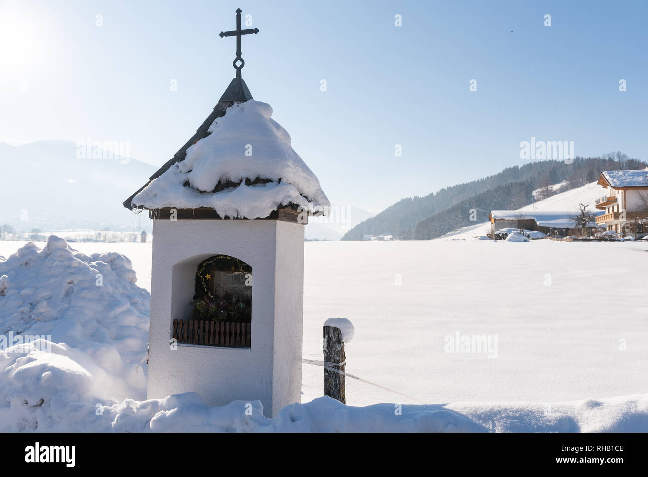 Mountain chapel in mountain landscape in winter under the snow. Schladming-Dachstein, Dachstein massif, Liezen District, Styria, Austria Stock Photo