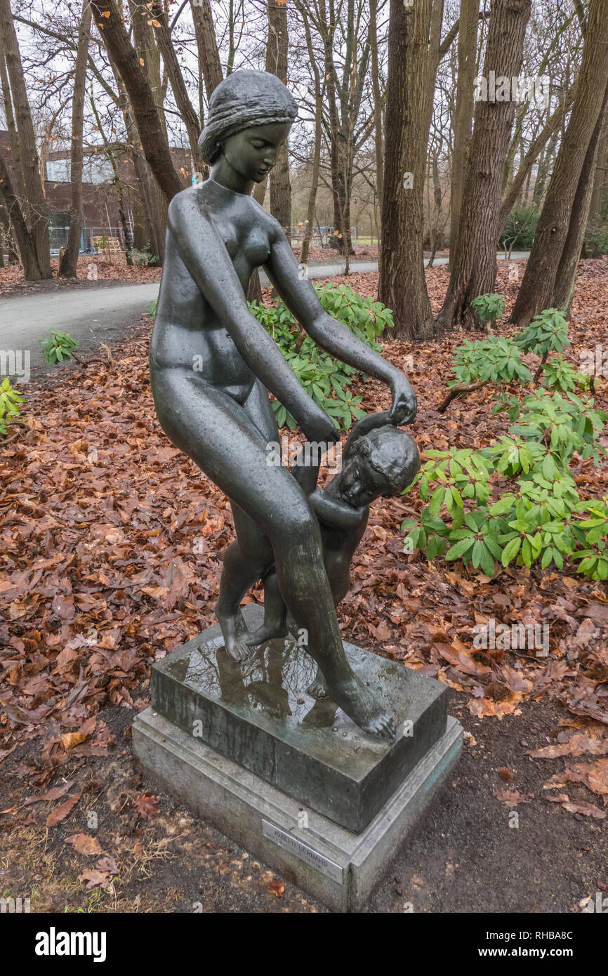 Bronze sculpture of dancing womand and child by Joseph Bernard 1925 in Middelheim Park Museum in Antwerp, Belgium Stock Photo