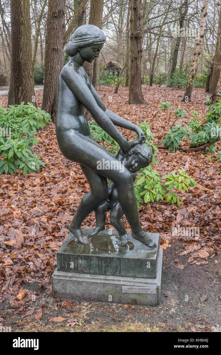 Bronze sculpture of dancing womand and child by Joseph Bernard 1925 in Middelheim Park Museum in Antwerp, Belgium Stock Photo
