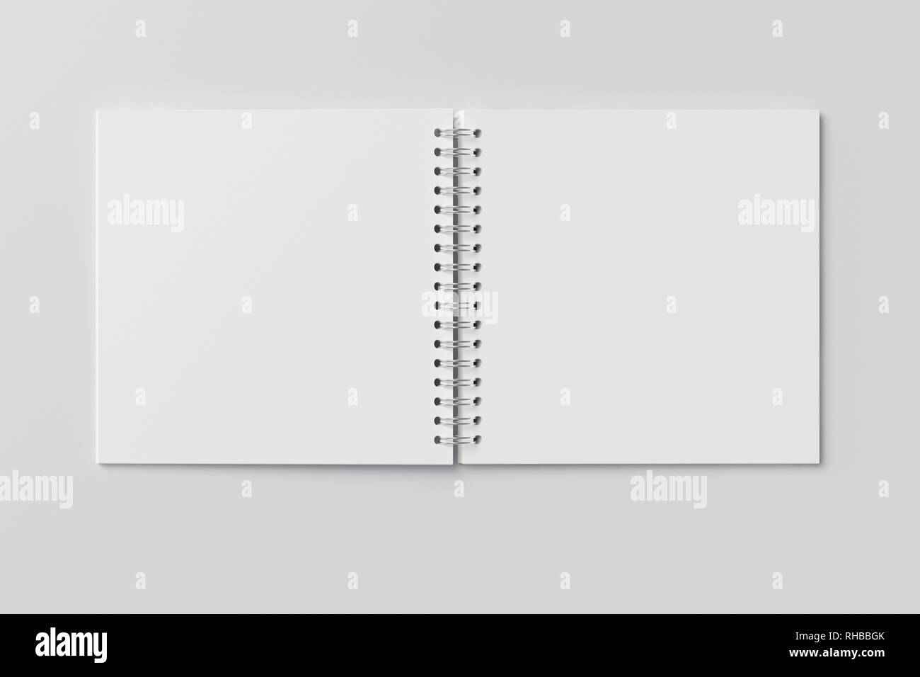 Blank open square spiral notepad on white background. With clipping path around notebook pages Stock Photo