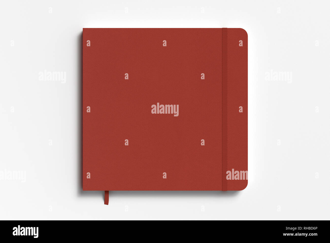 Red square notebook with elastic band on white background Stock Photo
