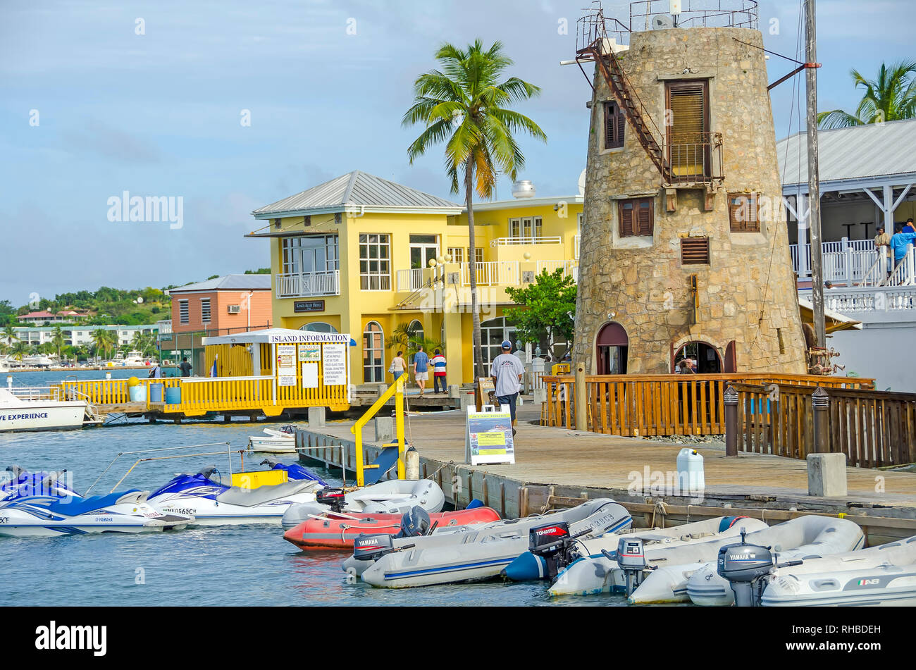 Christiansted Harbor Boardwalk with sugar mill restaurant and boats, Saint Croix,  U.S.  Virgin Islands Stock Photo
