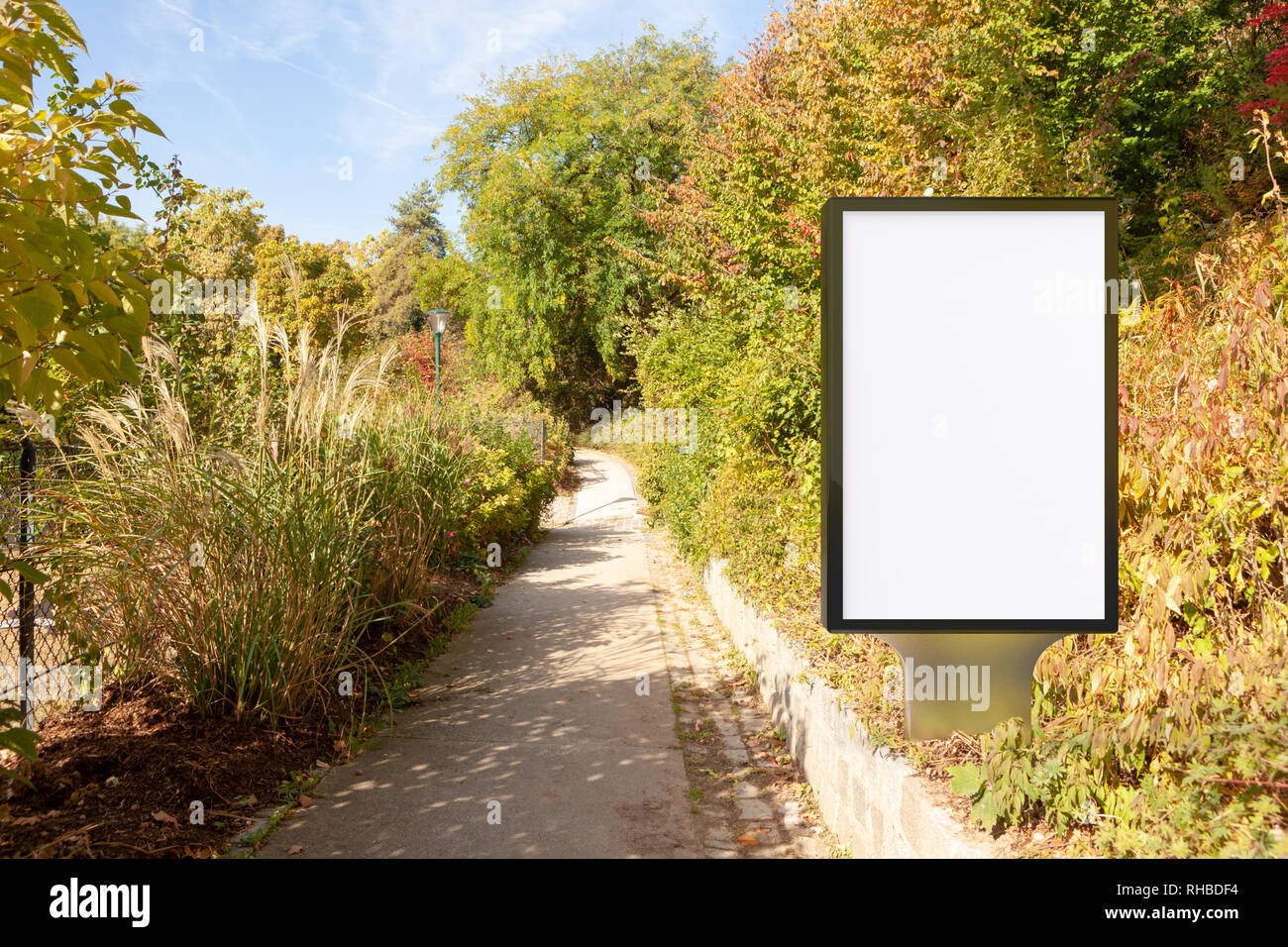 Blank street billboard poster stand in the park Stock Photo - Alamy