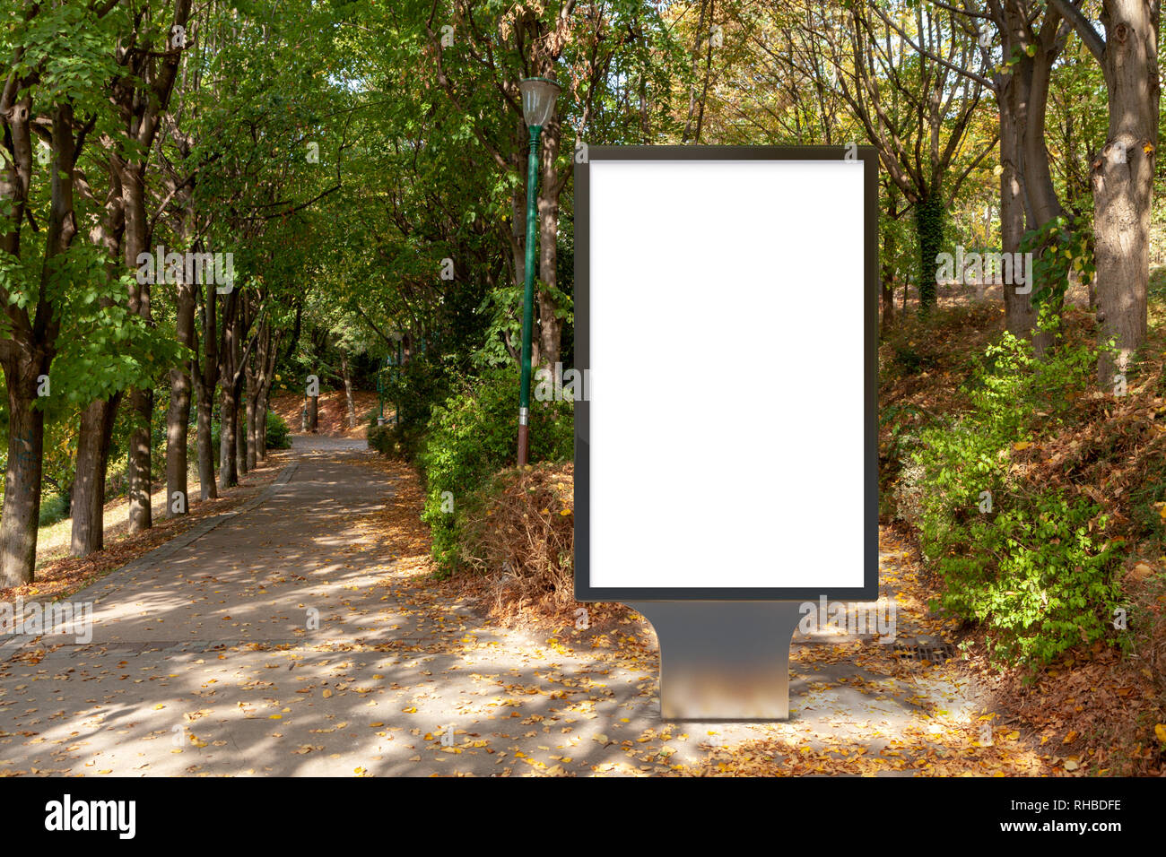 Blank street billboard poster stand in the park Stock Photo - Alamy