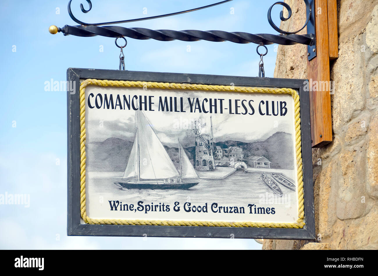 Comanche Mill  Yacht-less Club Sign  for resturant and bar on  Christiansted Boardwalk, Saint Croix,U.S.  Virgin  Islands Stock Photo