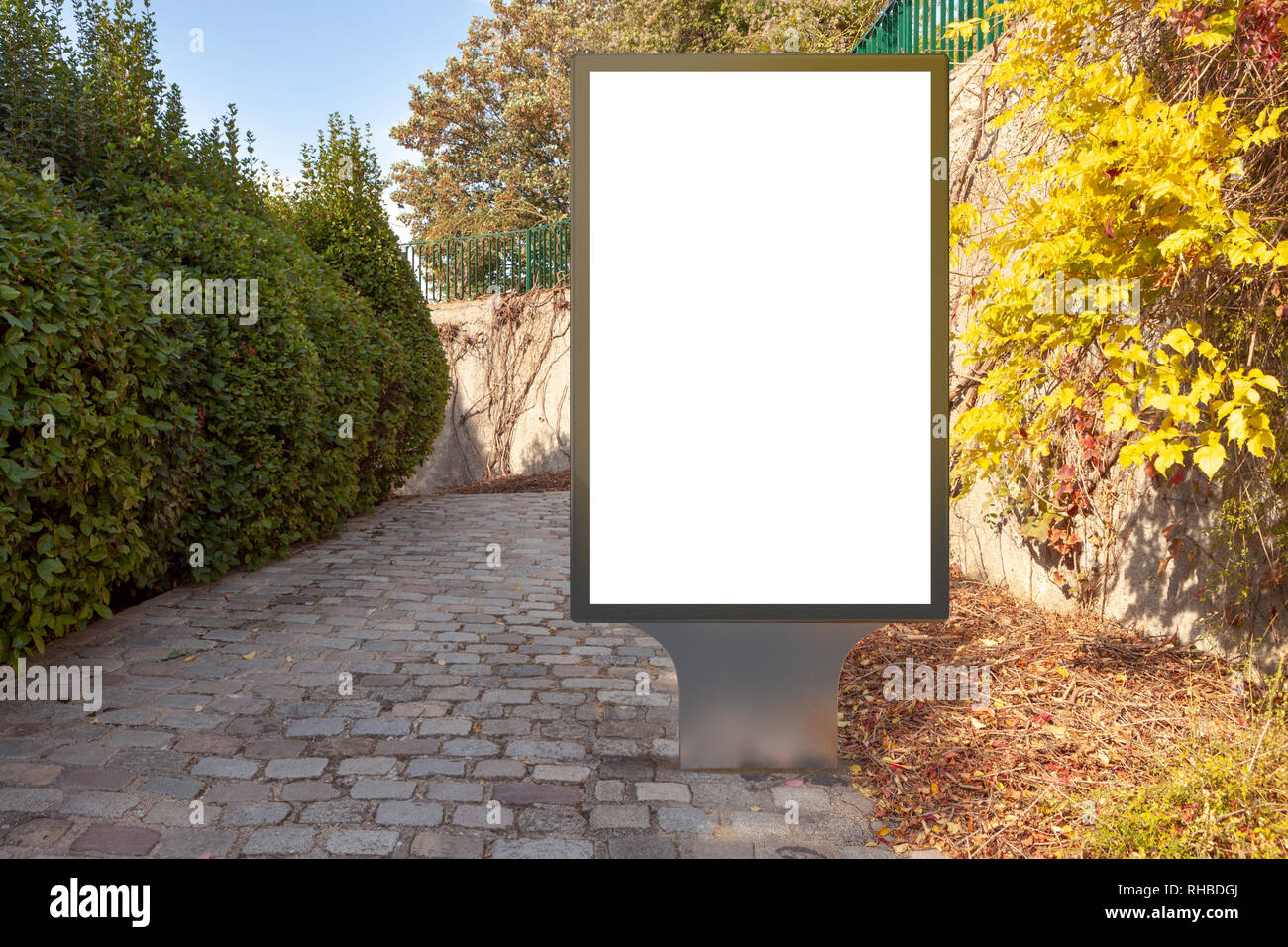 Blank street billboard poster stand in the park Stock Photo - Alamy