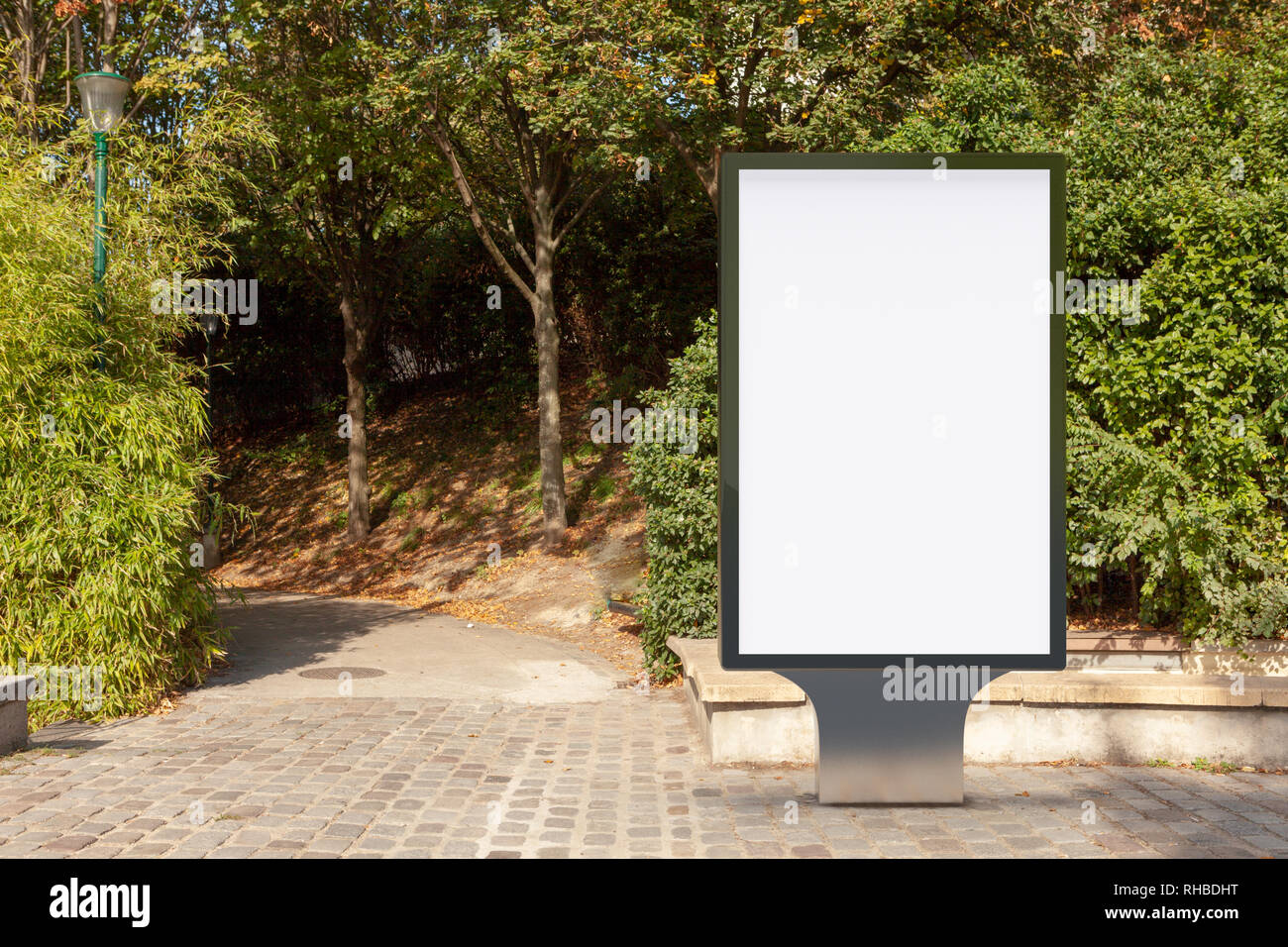 Blank street billboard poster stand in the park Stock Photo - Alamy