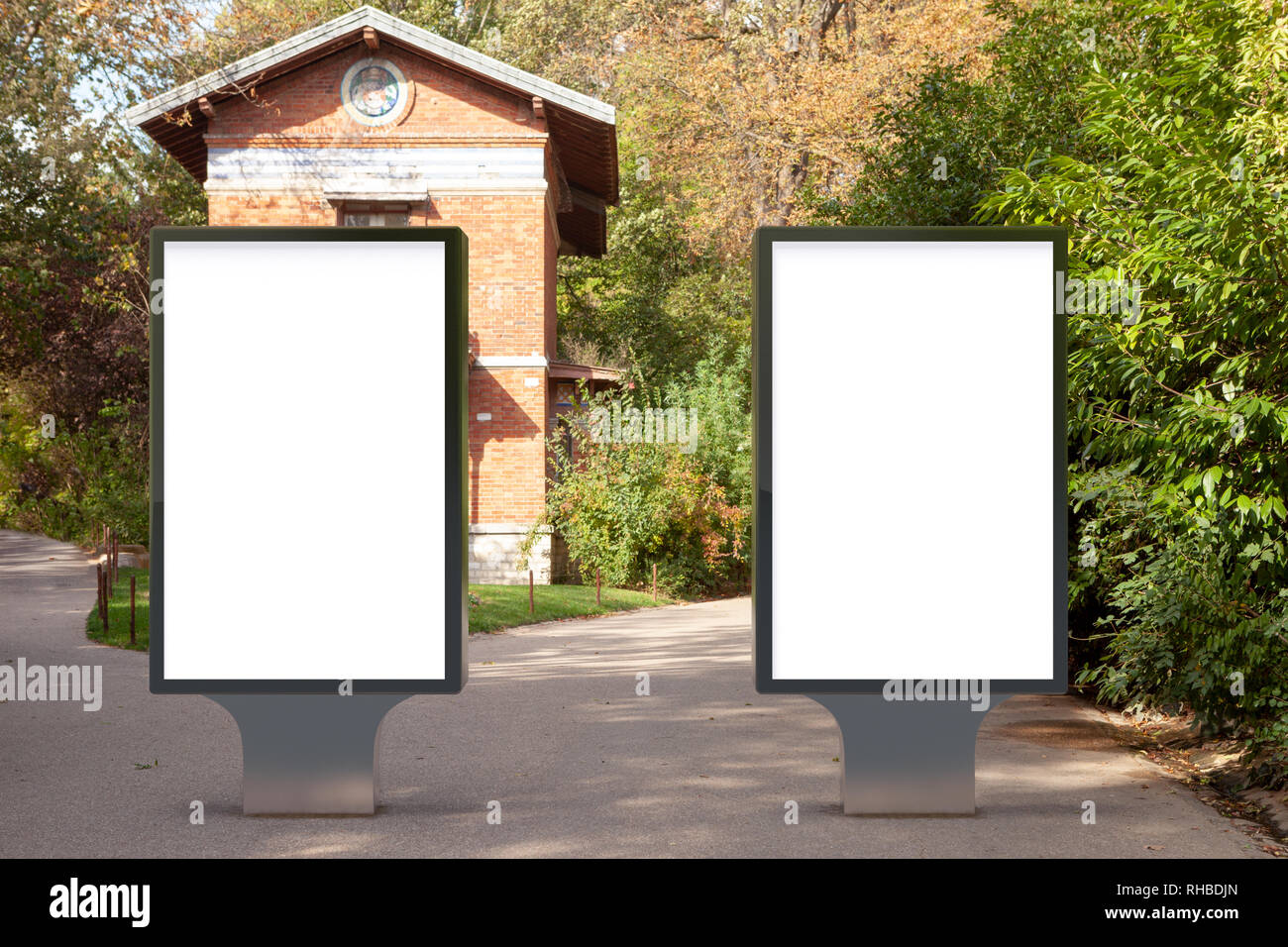 Blank street billboard poster stand in the park Stock Photo - Alamy