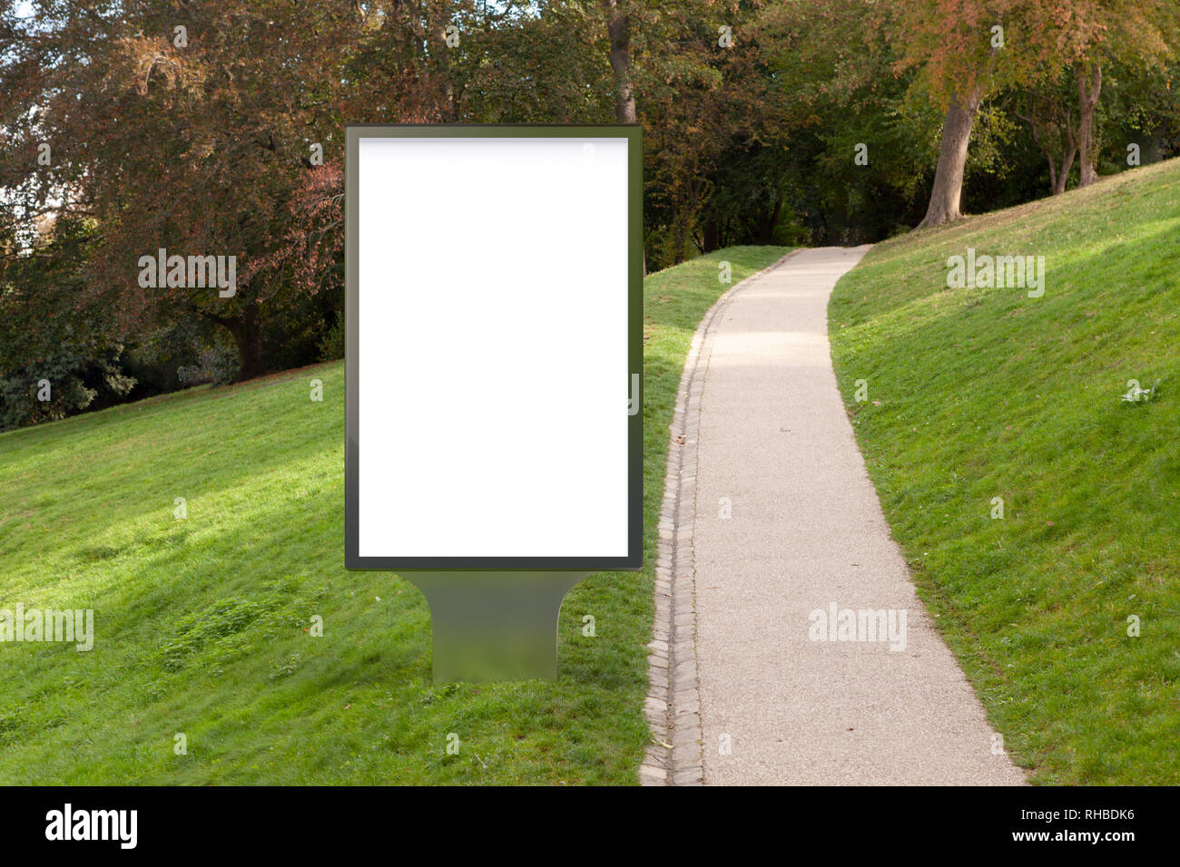 Blank street billboard poster stand in the park Stock Photo - Alamy