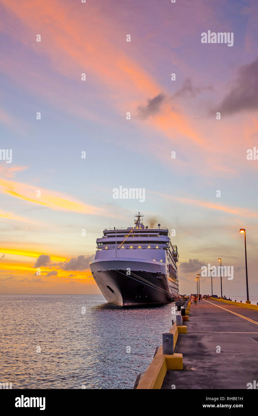 Cruise ship docked Frederiksted pier at twilight colortful clouds ms Maasdam Saint Croix, United States Virgin Islands USVI Stock Photo