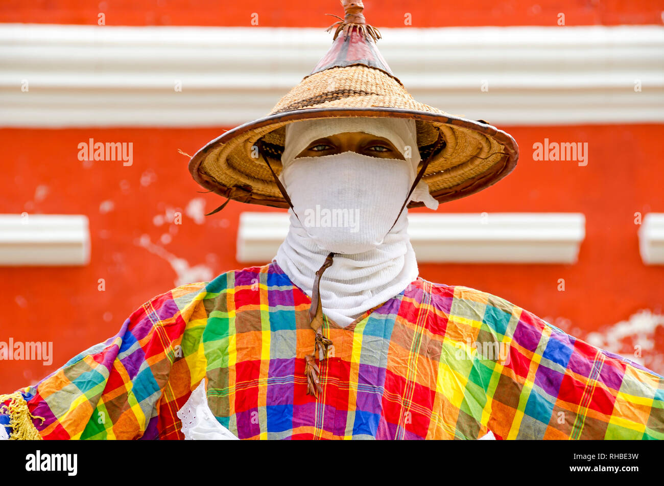 Face detail of Mocko Jumbie stilt walker reflects the African heritage