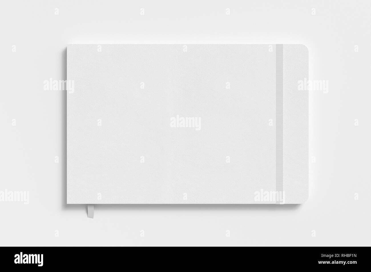 White horizontal notebook with elastic band on white background Stock Photo
