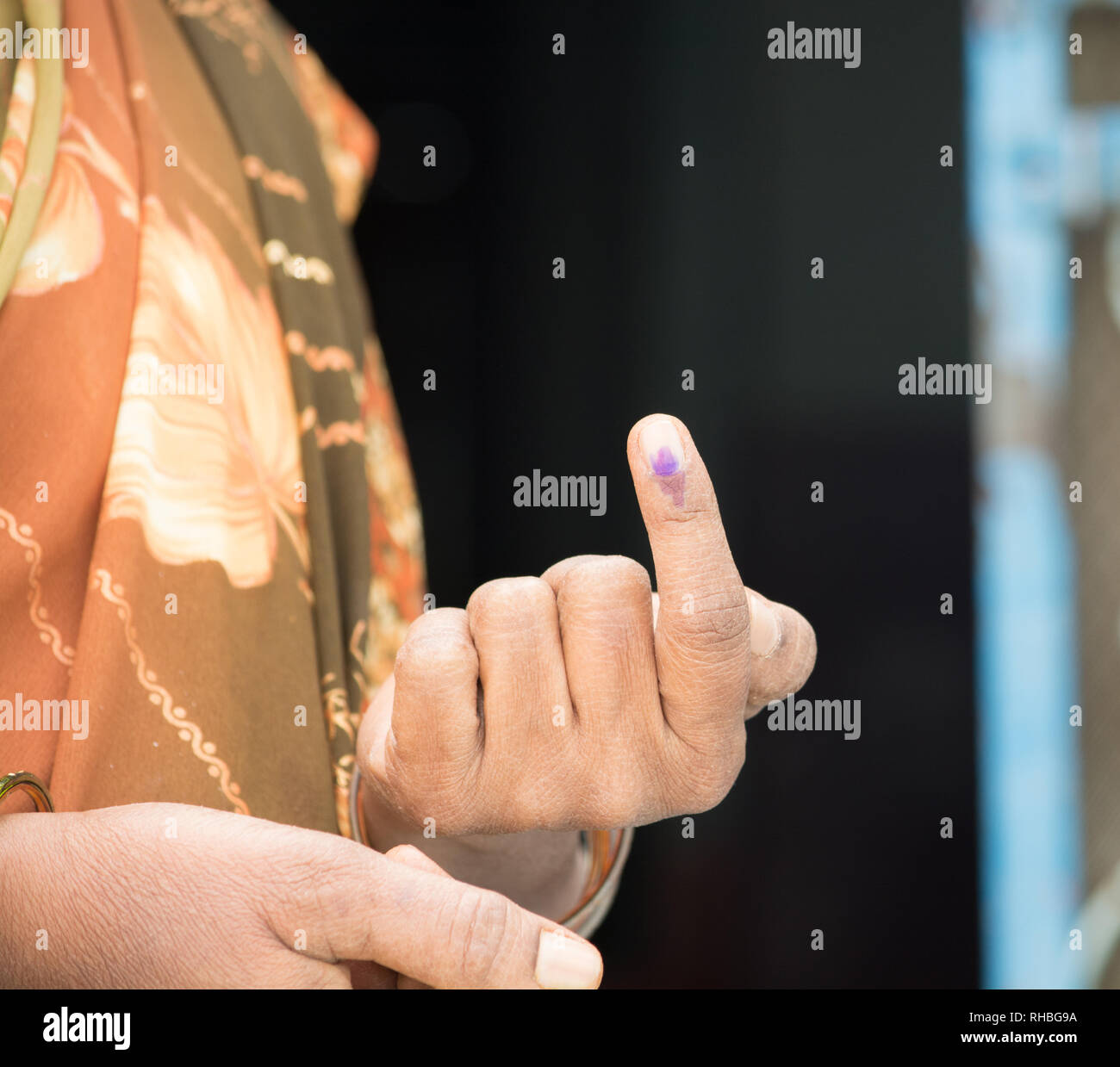 An Indian woman's hand showing voting mark after polling the Vote Stock Photo