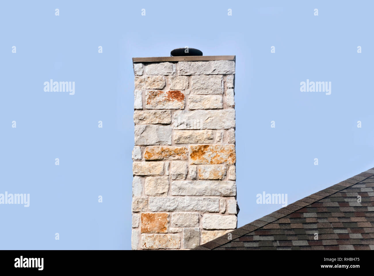 Limestone chimney on a shingle rooftop Stock Photo Alamy