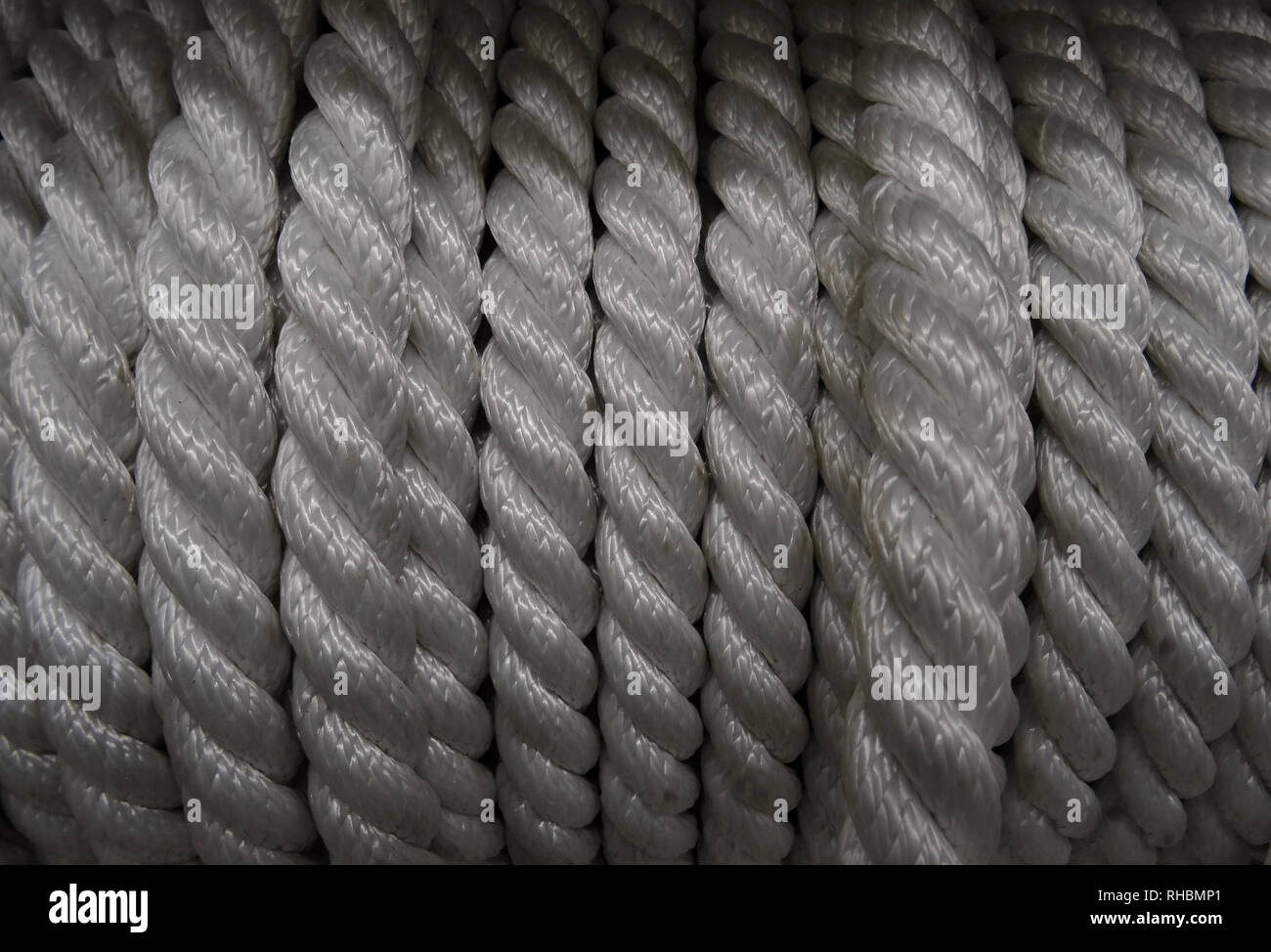 White synthetic fiber rope in bobbin detailed Stock Photo - Alamy