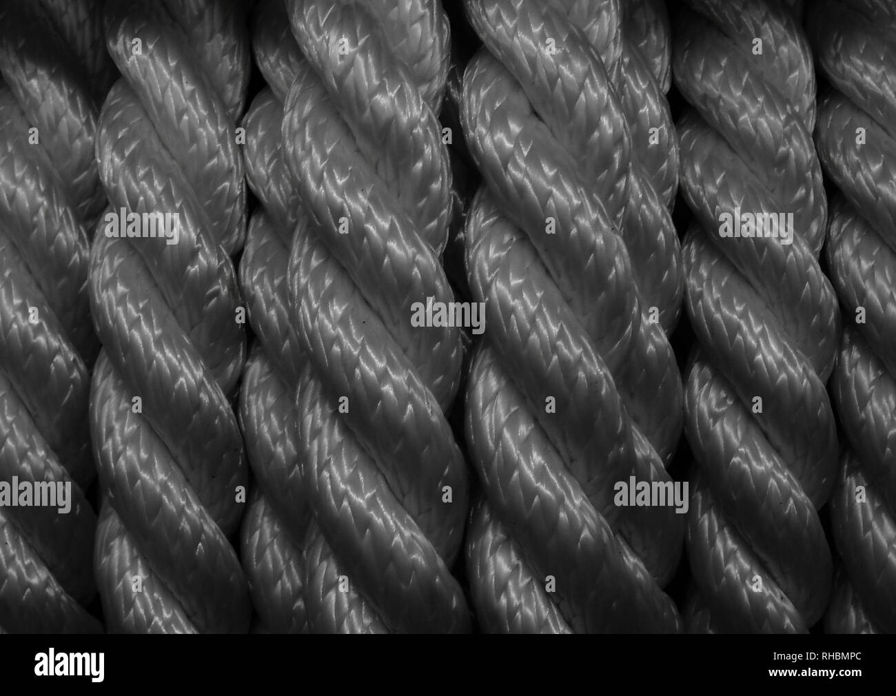 Rolled composite twisted synthetic cord macro shot texture background Stock Photo