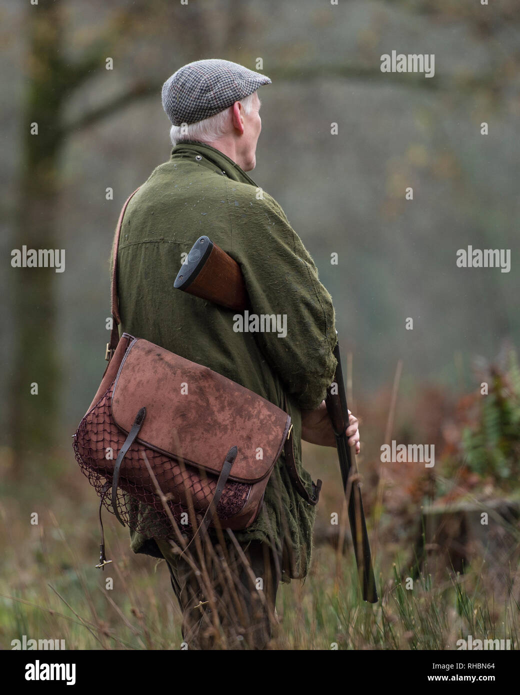 hunter with gun and gamebag Stock Photo