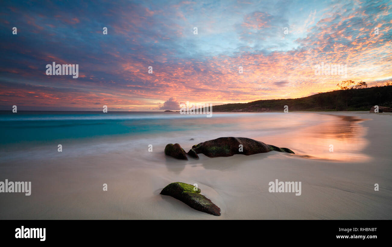 Art Beautiful sunset over the tropical beach Stock Photo - Alamy