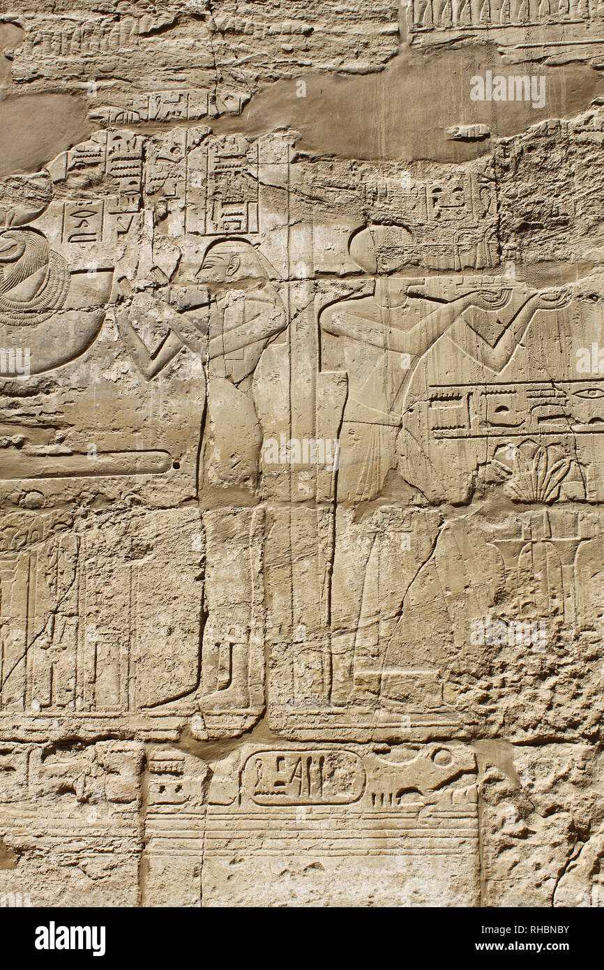 Ancient egypt images and hieroglyphics carved on the stone in the Karnak Temple, Luxor Stock Photo
