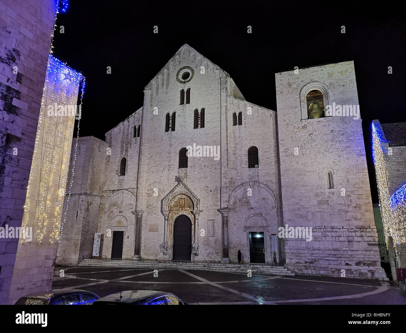The facade of Basilica of Saint Nicholas at night in Bari, Apulia - Italy Stock Photo