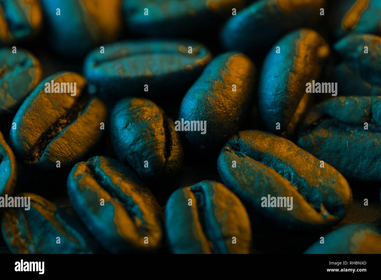 Roasted coffee bean close up in neon light background Stock Photo - Alamy