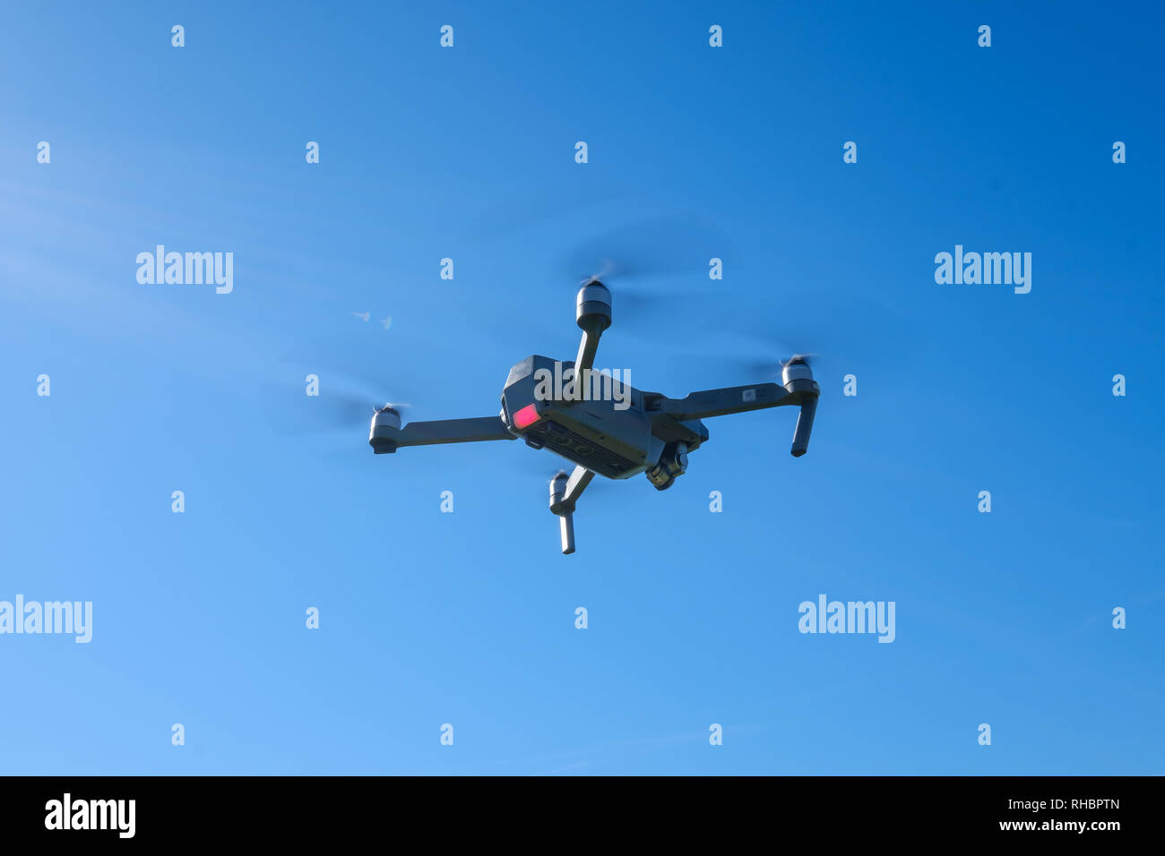 Folding drone flying in a sky Stock Photo - Alamy