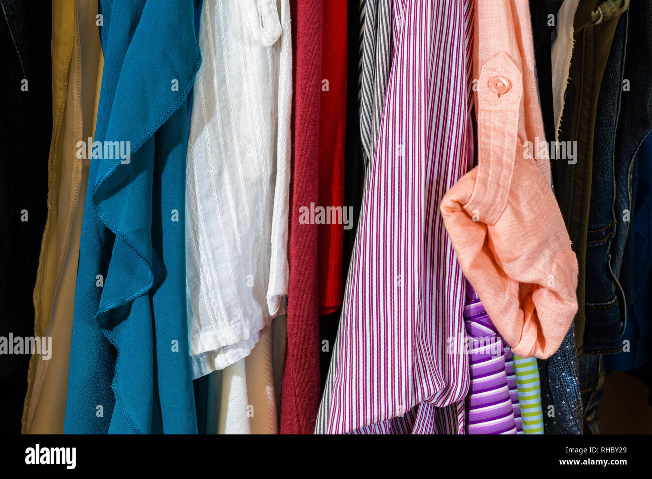 Closet woman can't decide, confused by outfits or needing to