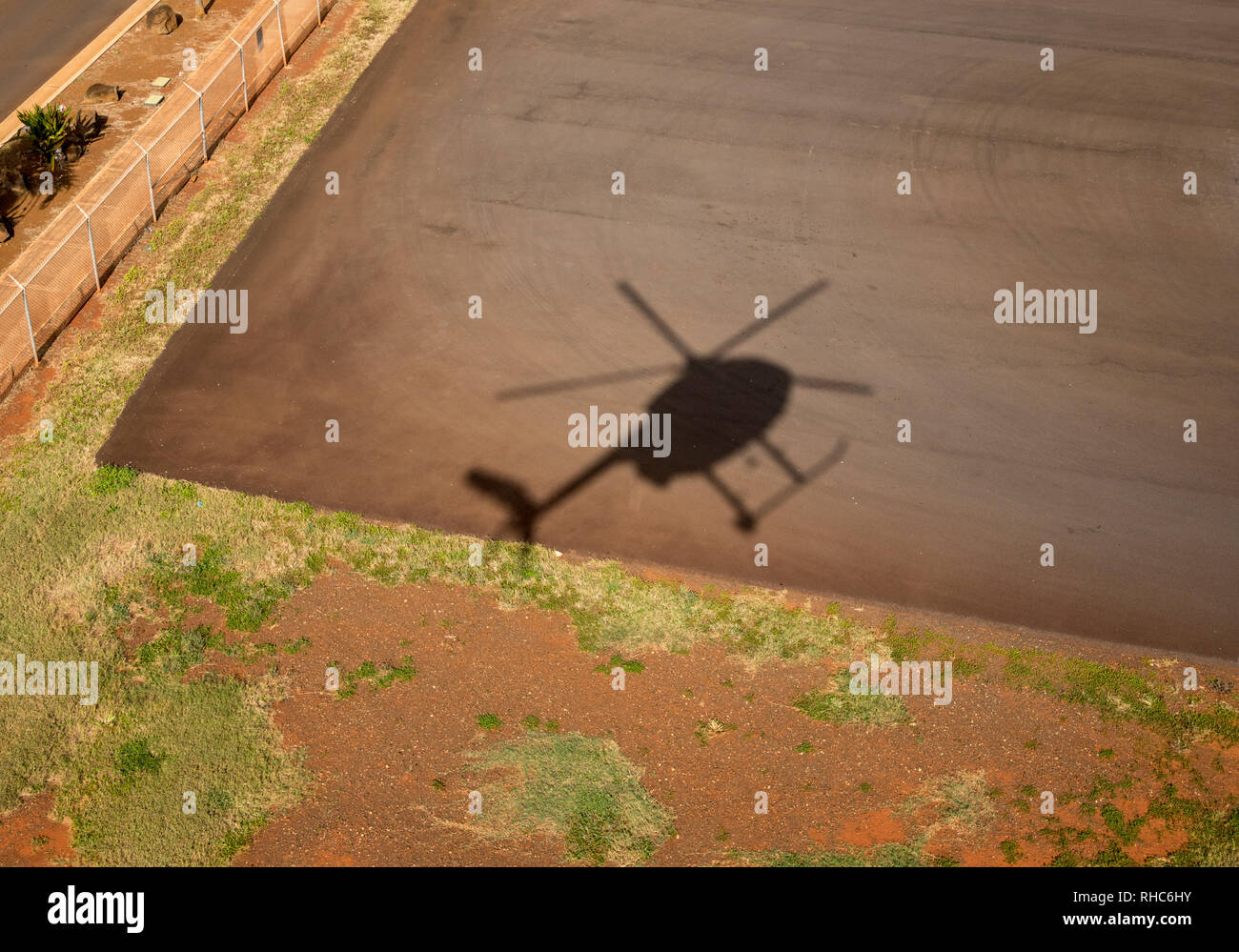 Open door helicopter shadow of Hughes 500 chopper Stock Photo
