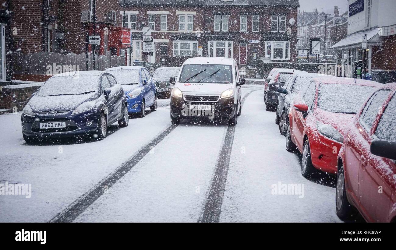 A van seen stopped during a snowfall in Sheffield city center. Cold