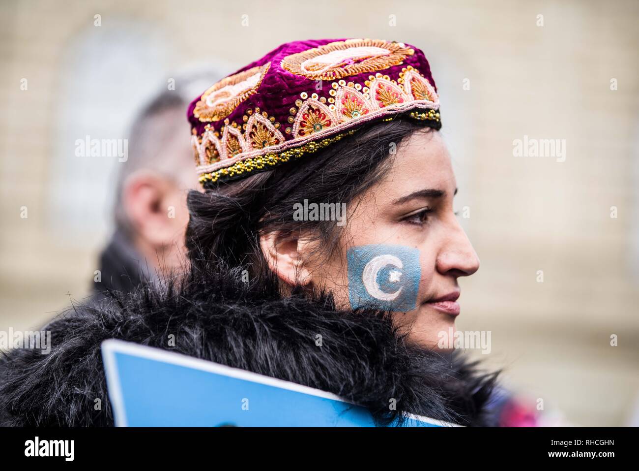 Munich, Bavaria, Germany. 2nd Feb, 2019. A uyghur has the flag of East Turkestan painted on her face. to protest against the so-called 'Muslim Crackdown'' by the Chinese Communist Party in the Xinjiang Autonomous Region of China. The region is contains roughly 26 million people, 11 million of whom are the ethnically Turkic Uyghurs who still call the region East Turkistan . The CCP has placed upwards of 1 million Uyghurs in reeducation camps, as well as performing widespread surveillance of the non-Han r Credit: ZU Credit: ZUMA Press, Inc./Alamy Live News Stock Photo