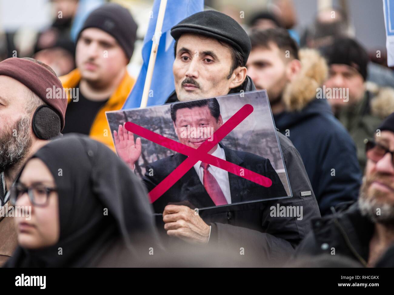 Munich, Bavaria, Germany. 2nd Feb, 2019. A protestor against the detentions of the Uyghurs in China holds a sign of a crossed out President Xi Jinping of China. to protest against the so-called 'Muslim Crackdown'' by the Chinese Communist Party in the Xinjiang Autonomous Region of China. The region is contains roughly 26 million people, 11 million of whom are the ethnically Turkic Uyghurs who still call the region East Turkistan . The CCP has placed upwards of 1 million Uyghurs in reeducation camps, as Credit: ZUM Credit: ZUMA Press, Inc./Alamy Live News Stock Photo