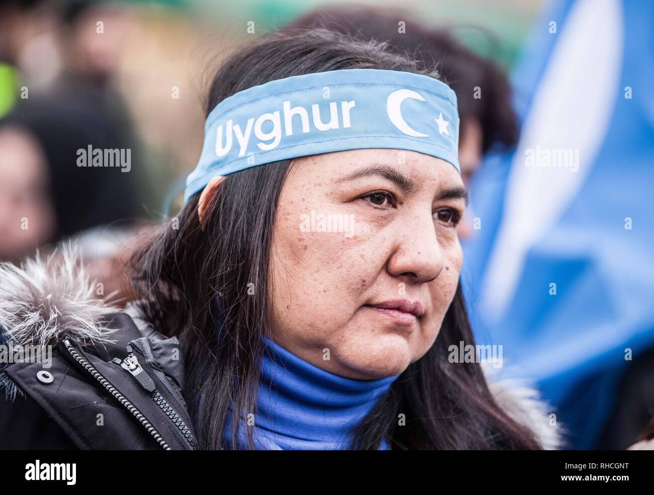 Munich, Bavaria, Germany. 2nd Feb, 2019. A woman at a protest in Germany against the detention of the Uyghurs in China wears a headband with the colors and flag of East Turkestan- the Xinjiang Autonomous Region in China. to protest against the so-called 'Muslim Crackdown'' by the Chinese Communist Party in the Xinjiang Autonomous Region of China. The region is contains roughly 26 million people, 11 million of whom are the ethnically Turkic Uyghurs who still call the region East Turkistan . The CCP has p Credit: ZU Credit: ZUMA Press, Inc./Alamy Live News Stock Photo