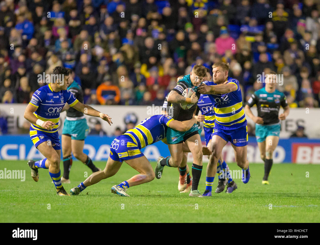 Halliwell Jones Stadium, Warrington, UK. 2nd Feb, 2019. Betfred Super League rugby, Warrington Wolves versus Leeds Rhinos; Liam Sutcliffe is tackled by Chris Hill and Jack Hughes Credit: Action Plus Sports/Alamy Live News Stock Photo