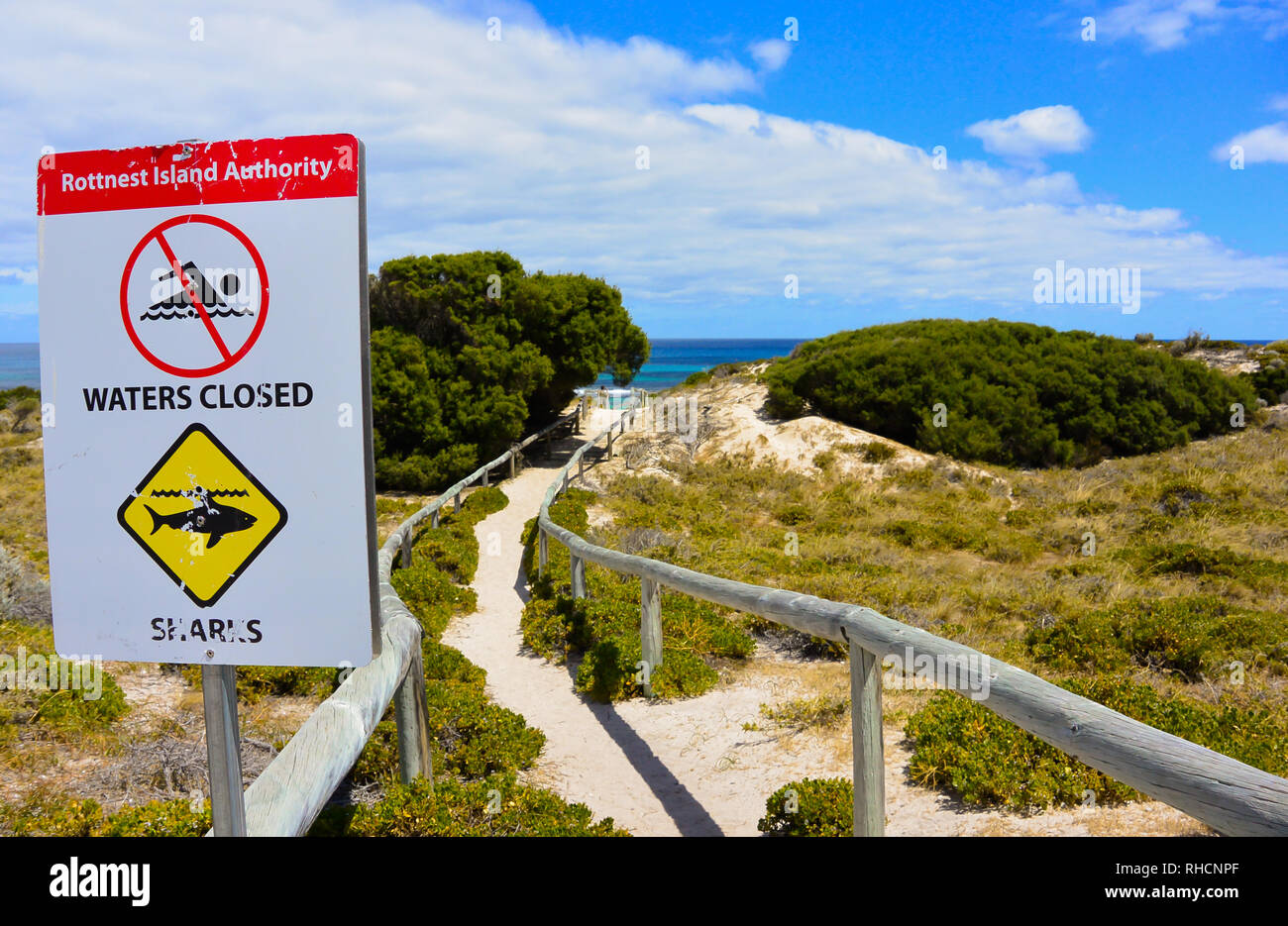 Danger sign on the beach with sea in the background hi-res stock ...